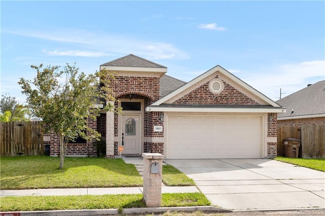 view of front of home featuring a garage and a front lawn