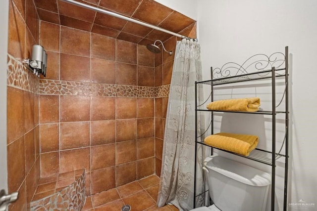 bathroom featuring curtained shower and toilet