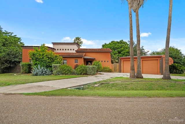 view of front of house with a front lawn and a garage