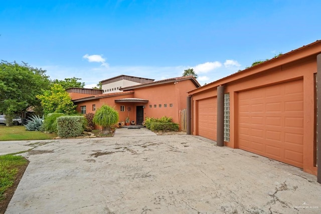 view of front of property with a garage