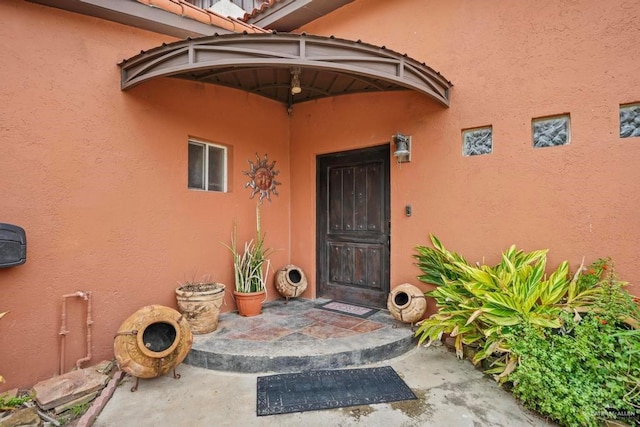 property entrance with a patio area