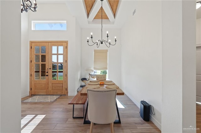 13801 N 37th St, Mcallen, TX 78504 - dining area featuring a chandelier, a towering ceiling, healthy amount of natural light, and wood finished floors