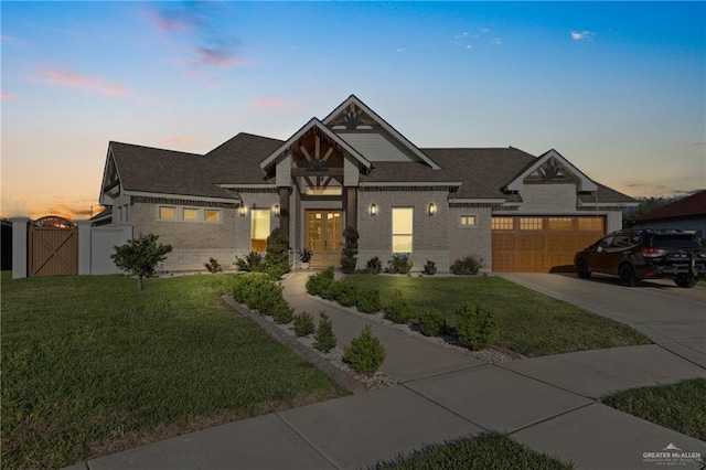 13801 N 37th St, Mcallen, TX 78504 - view of front of property featuring a gate, driveway, a lawn, french doors, and brick siding
