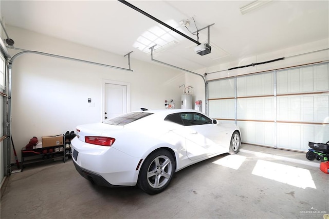 13801 N 37th St, Mcallen, TX 78504 - garage featuring water heater and a garage door opener