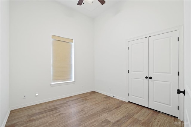 13801 N 37th St, Mcallen, TX 78504 - unfurnished bedroom featuring light wood-style flooring, a closet, and a ceiling fan