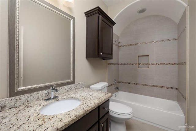 full bathroom featuring tub / shower combination, toilet, vanity, and tile patterned flooring