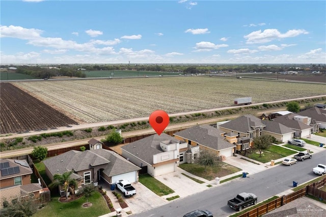 birds eye view of property with a residential view and a rural view