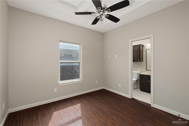 unfurnished room with ceiling fan, baseboards, and dark wood-style floors