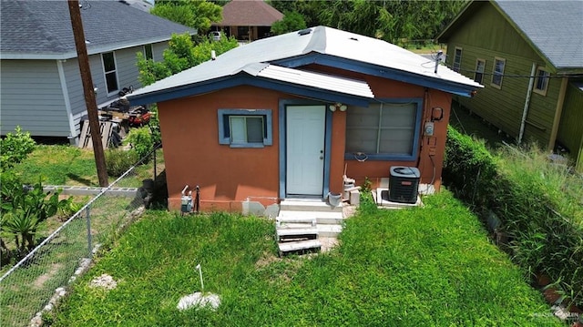 view of outdoor structure featuring central air condition unit