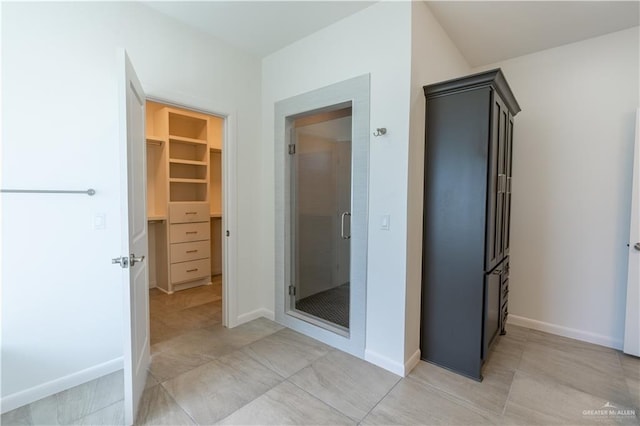 bathroom with a shower with shower door