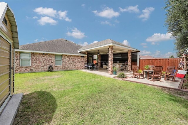 3601 Stratosphere Dr, Edinburg, TX 78539 - back of property with a patio area, brick siding, and a shingled roof