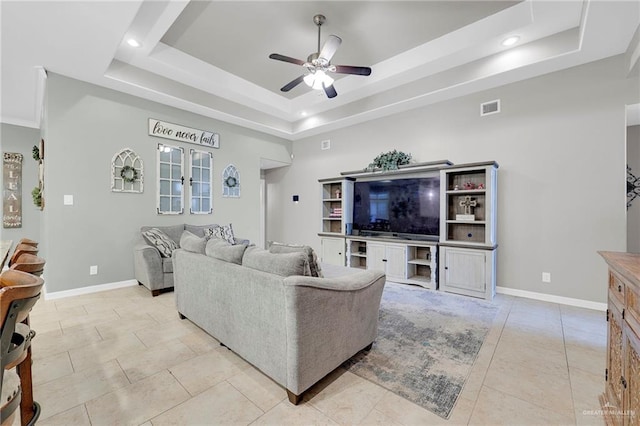 3601 Stratosphere Dr, Edinburg, TX 78539 - living room featuring a raised ceiling, a ceiling fan, light tile patterned floors, and recessed lighting