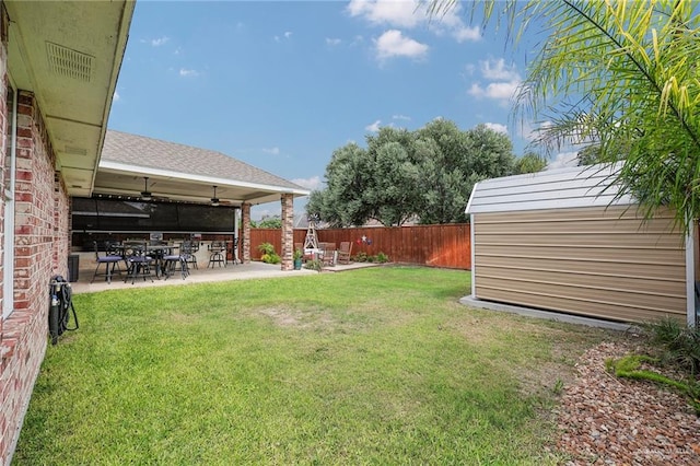 3601 Stratosphere Dr, Edinburg, TX 78539 - fenced backyard featuring a ceiling fan, a patio, and a storage shed