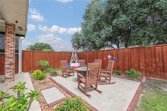 3601 Stratosphere Dr, Edinburg, TX 78539 - fenced backyard with a patio and an outdoor fire pit