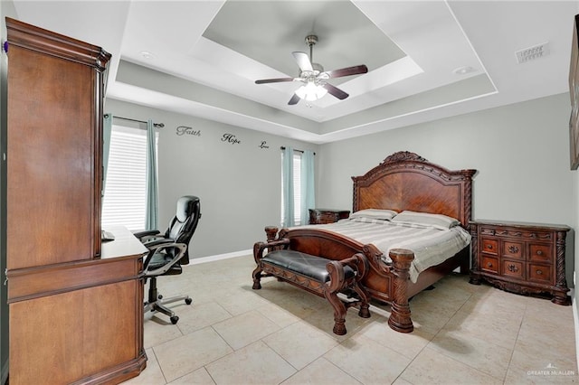 3601 Stratosphere Dr, Edinburg, TX 78539 - bedroom with a raised ceiling, a ceiling fan, a desk, and light tile patterned flooring