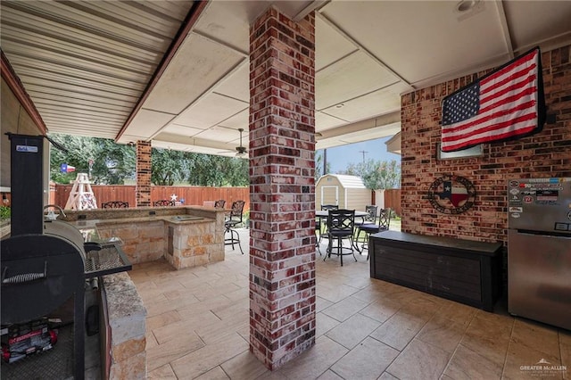 3601 Stratosphere Dr, Edinburg, TX 78539 - fenced backyard with a storage unit, outdoor dining space, and a patio