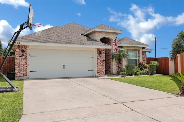 3601 Stratosphere Dr, Edinburg, TX 78539 - ranch-style house with brick siding, concrete driveway, an attached garage, and a shingled roof