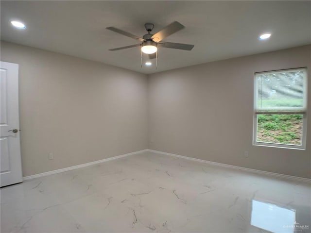 spare room featuring ceiling fan