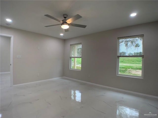 spare room featuring ceiling fan