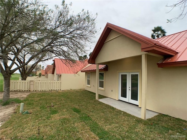 view of yard featuring french doors