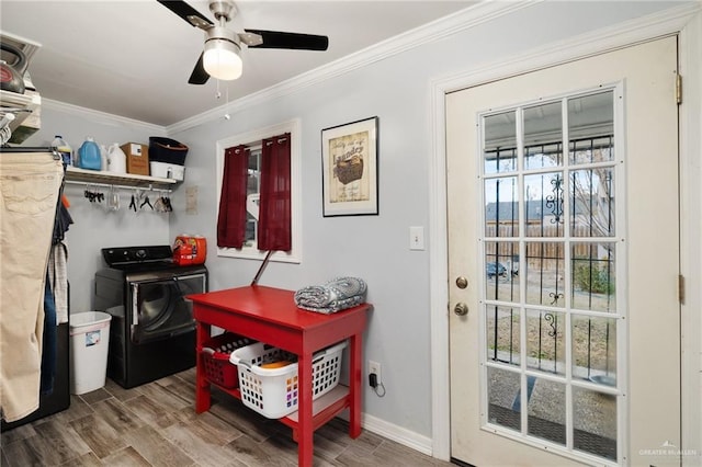 doorway featuring ornamental molding, hardwood / wood-style floors, ceiling fan, and washing machine and dryer