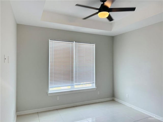 5512 N Crown Pt, Pharr, TX 78577 - empty room with a raised ceiling, a ceiling fan, and light tile patterned floors