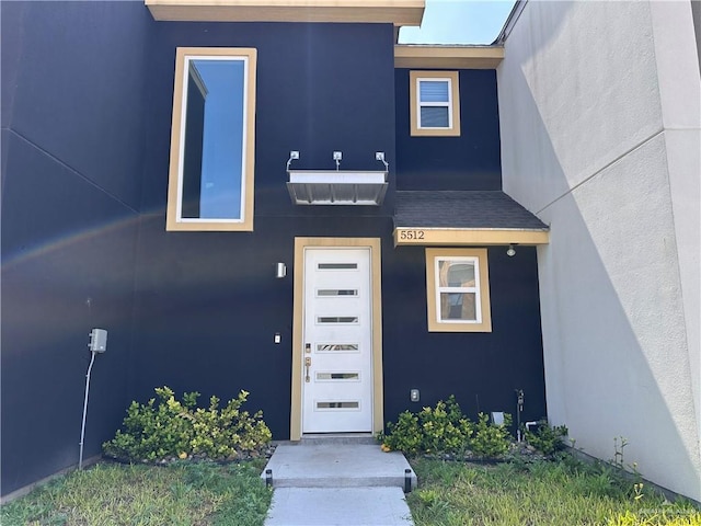 5512 N Crown Pt, Pharr, TX 78577 - doorway to property featuring stucco siding