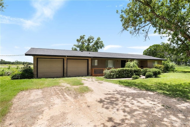21890 Fm 508, Harlingen, TX 78550 - single story home with dirt driveway, an attached garage, a front lawn, and brick siding