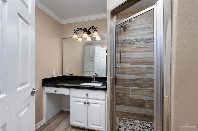 21890 Fm 508, Harlingen, TX 78550 - bathroom with crown molding, a stall shower, vanity, and wood finished floors
