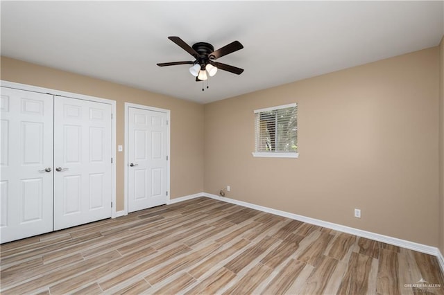 21890 Fm 508, Harlingen, TX 78550 - unfurnished bedroom with light wood finished floors, a closet, and a ceiling fan
