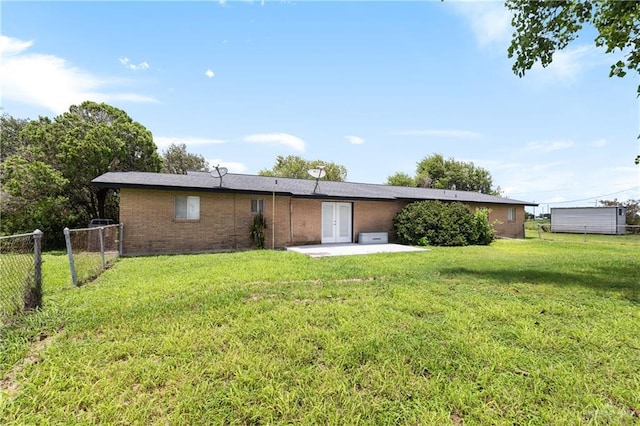 21890 Fm 508, Harlingen, TX 78550 - back of house with brick siding, french doors, and a patio