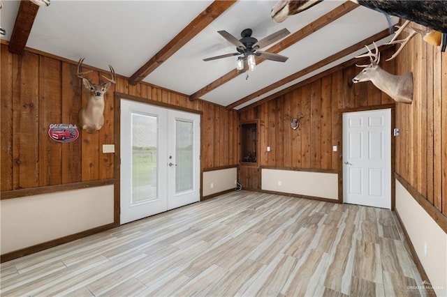 21890 Fm 508, Harlingen, TX 78550 - unfurnished living room with wood walls, french doors, wood finished floors, and a ceiling fan
