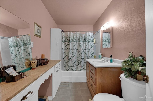 full bathroom featuring vanity, toilet, and shower / bath combo with shower curtain