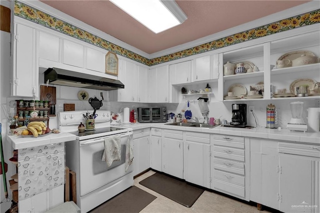 kitchen with white cabinetry, electric range, and sink