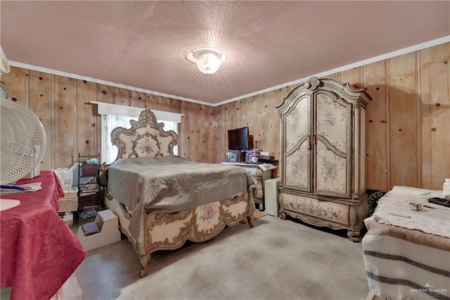 bedroom with a textured ceiling, crown molding, and wood walls