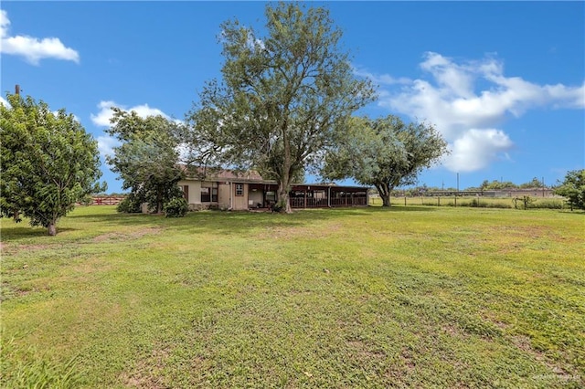 view of yard with a rural view