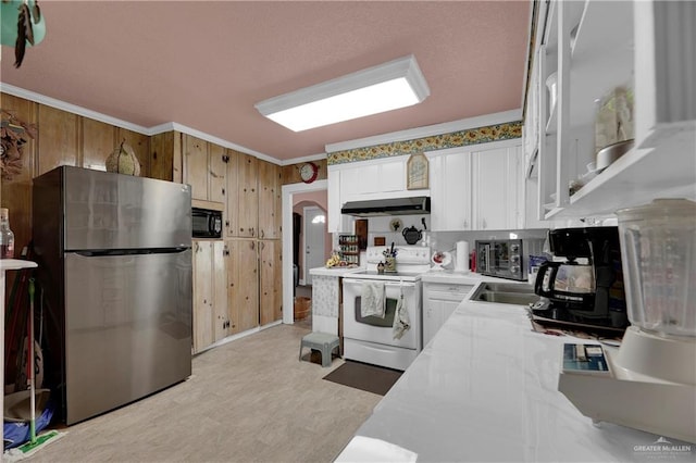 kitchen featuring stainless steel fridge, ornamental molding, black microwave, white cabinets, and white range with electric cooktop