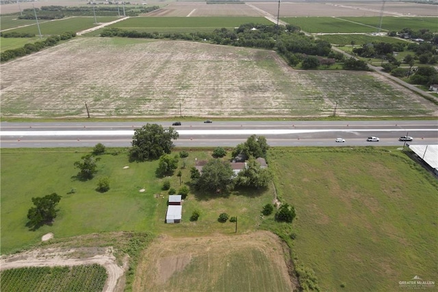 birds eye view of property featuring a rural view