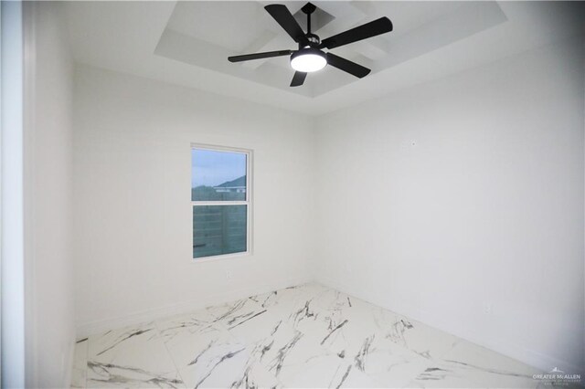 empty room featuring ceiling fan with notable chandelier, beamed ceiling, and coffered ceiling