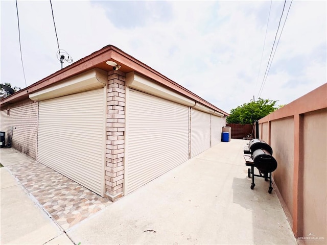 view of property exterior featuring central air condition unit and fence