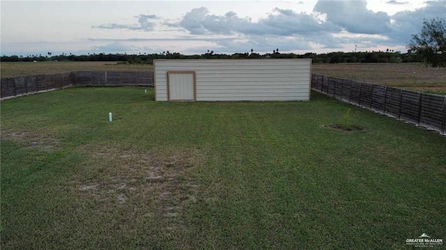 view of yard with a rural view