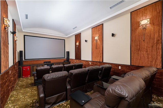 home theater with lofted ceiling and visible vents