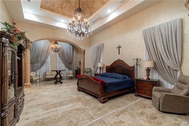 bedroom featuring an inviting chandelier, visible vents, arched walkways, and a raised ceiling