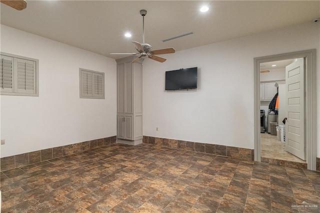 empty room with recessed lighting, visible vents, a ceiling fan, baseboards, and stone finish flooring