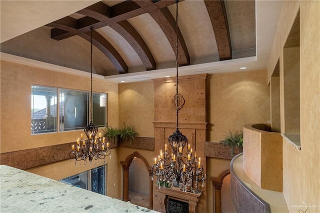 interior space featuring vaulted ceiling with beams and a notable chandelier