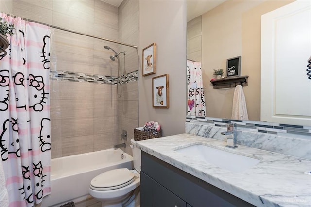 full bath featuring toilet, shower / bathtub combination with curtain, and vanity