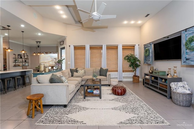 living area with crown molding, recessed lighting, visible vents, light tile patterned flooring, and ceiling fan