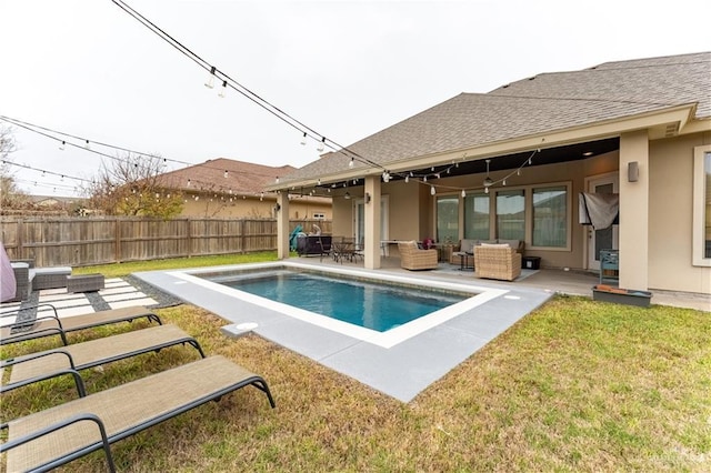 view of swimming pool with a fenced in pool, fence, an outdoor living space, and a patio