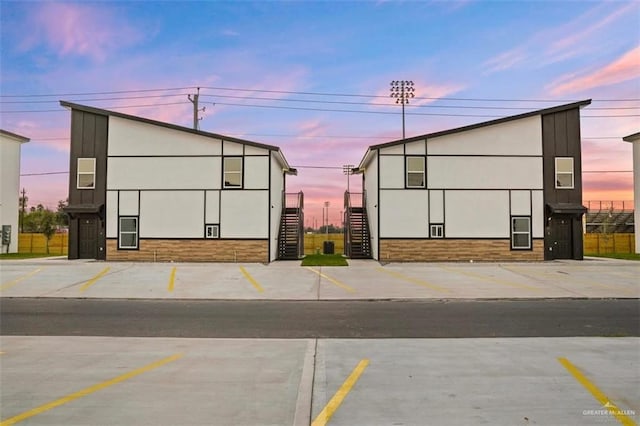 view of outdoor building at dusk