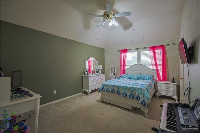 carpeted bedroom with ceiling fan and vaulted ceiling